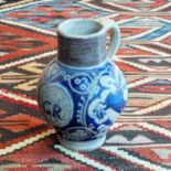 A Westerwald stoneware jug, early 18th century, of globular form, inscribed GR within a cartouche,