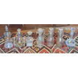 A collection of seven Georgian and later glass decanters and stoppers, to include cut and silver
