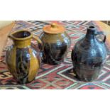 Winchcombe Pottery, a cider flagon, incised foliate decoration, height 38cm, together with another