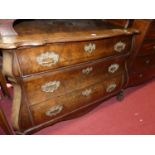 A 19th century Dutch walnut Serpentine front bombe shaped three-drawer commode, width 122cm