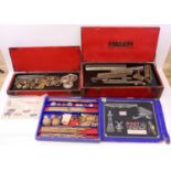 Two Erector sets, including a double-layered wooden case containing a digger bucket, boiler, wheel