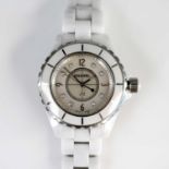 A lady's Chanel J12 ceramic watch, ref. H1628, No.55949, circa 2009, having a signed white dial with