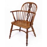 A Victorian elm seat, yew and beechwood Windsor chair, having a pierced vase splatback above a