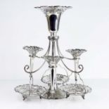 An Edwardian Art Nouveau silver six-branch epergne, the trumpet form column with scroll pierced