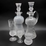 An extensive part-suite of Edinburgh Crystal Thistle pattern glassware, comprising one claret jug