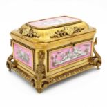 A late 19th century French porcelain and ormolu mounted jewellery casket, the inset porcelain panels