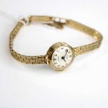 A Rotary lady's 9ct gold cased wristwatch, on 9ct gold brick link bracelet, with safety chain,