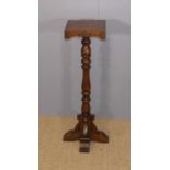 An Old Charm oak plant stand, h.92cm