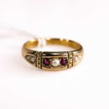 A late Victorian 15ct gold ruby and seed pearl set half hoop ring, Chester 1891, size M/N, 2.6g