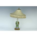 A Chinese famille rose figure of a boy converted into a table lamp, Qing dynasty, Qianlong period (