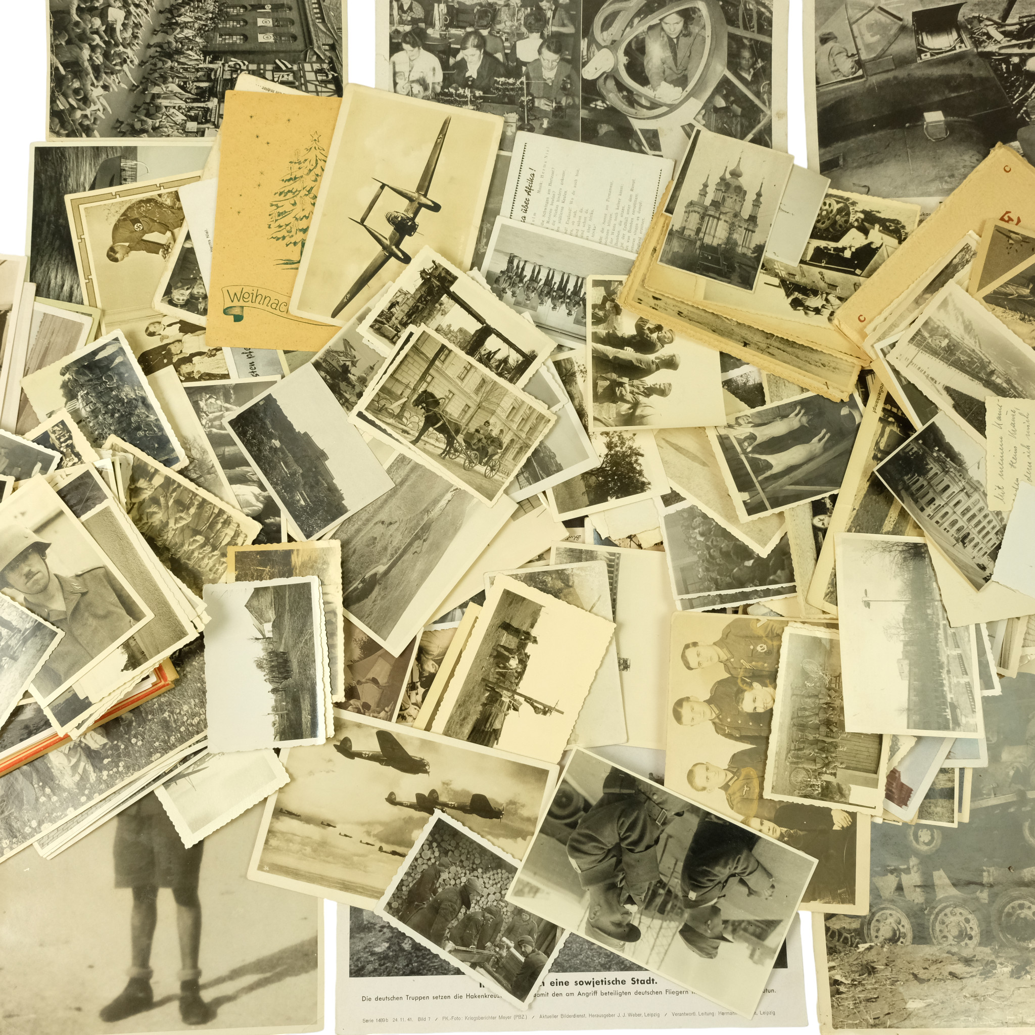 A group of German Third Reich personal photographs and postcards, etc