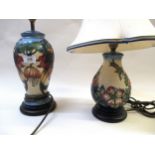 Two Moorcroft baluster form lamp bases, one decorated with hibiscus, the other with peony on