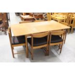 Mid 20th Century rectangular teak extending dining table with integral leaf and a set of six