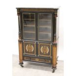 Aesthetic movement ebonised walnut banded and gilded side cabinet with two glazed doors and two