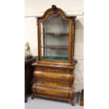 18th Century Dutch floral marquetry inlaid display cabinet on bombe chest, the arched glazed top