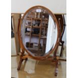Reproduction yew wood oval swing frame toilet mirror, together with a Victorian towel rail