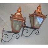 Pair of copper mounted wrought iron wall lights Copper lanterns are 45cm high and they project