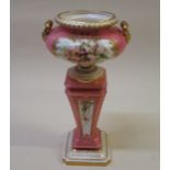 Royal Worcester pedestal vase, painted with panels of flowers on a pink ground, 13cm high (restored)