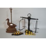Cast iron doorstop, in the form of a goose, together with a set of scales with brass weights