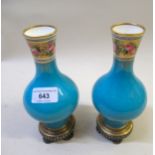 Pair of Minton baluster form vases, the narrow necks painted with bands of roses above crackle