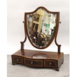 Edwardian mahogany and satinwood crossbanded swing frame toilet mirror, the bevelled shield shaped