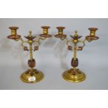 Pair of Arts & Crafts copper mounted two branch candelabra, 30cm high