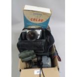 Canon EOS 300 SLR camera, an Olympus 600 camera, three pairs of binoculars, a microscope and a