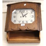 1950s Oak cased two train wall clock, together with a small Smiths Bakelite clock and an oak