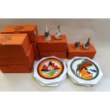 Collection of Wedgwood Clarice Cliff Bizarre pattern plates and condiments in original boxes,