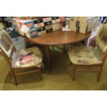 Mid 20th Century G Plan teak circular dining table with integral folding leaf on tapering circular