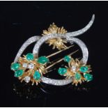 A yellow and white metal diamond and emerald set spray brooch, mid 20th century, set with ten pear