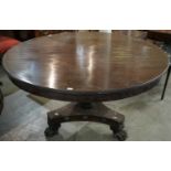 A 19th century mahogany tilt top centre table, the top over a turned tapering pedestal with