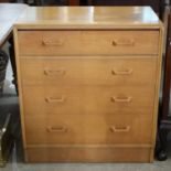 A mid-century oak chest of drawers, G-Plan, the four drawers fitted with solid oak shaped handles,