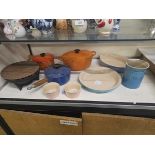 Nine pieces of Le Creuset to include lidded dishes and saucepans etc.