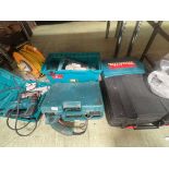 A range of tools including three Makita drill, jig saw, extension lead and a Trend grouter etc.