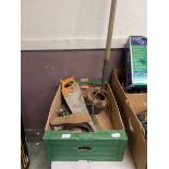 A tray containing a cobblers last, hay fork, saws and other tools