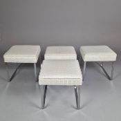 SET OF FOUR CONTEMPORARY FOOTSOOLS ON CHROME BASES.