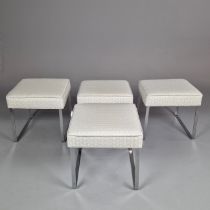 SET OF FOUR CONTEMPORARY FOOTSOOLS ON CHROME BASES.