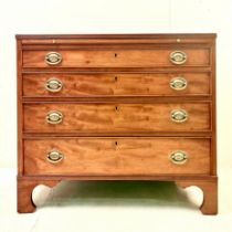 GEORGIAN STYLE MAHOGANY CHEST OF FOUR DRAWERS RAISED ON BRACKETS SUPPORTS.