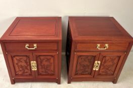 PAIR OF CHINESE TEAK BEDSIDE CABINETS WITH CARVED PANEL DOORS BY GEORGE ZEE.