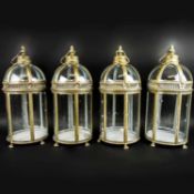 SET OF FOUR REGENCY STYLE GILT METAL AND GLASS LANTERNS.