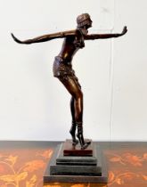 ART DECO STYLE BRONZE SCULPTURE OF A DANCER ON A STEPPED MARBLE BASE.