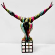 CONTEMPORARY DIVER SCULPTURE IN PAINT SPLATTERED FINISH.