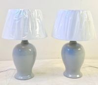 PAIR OF GREY CERAMIC TABLE LAMPS WITH WHITE SHADES.
