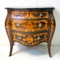 FRENCH BOMBE COMMODE WITH FLORAL MARQUETRY INLAY.