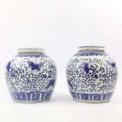 PAIR OF CHINESE BLUE AND WHITE CERAMIC LIDDED GINGER JARS.