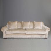 SAND COLOURED FABRIC UPHOLSTERED SOFA.