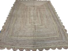 SCALLOPED EDGE JUTE CARPET.