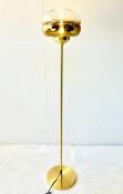 CONTEMPORARY GILT METAL FLOOR LAMP WITH GLASS SHADE.