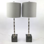 PAIR OF SILVERED METAL FAUX BAMBOO TABLE LAMPS WITH GREY LINEN SHADES.